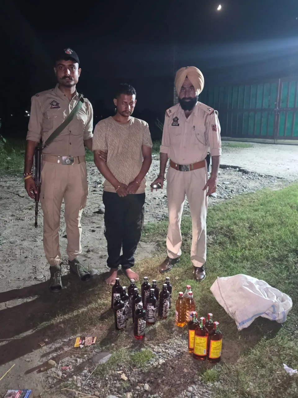 18 BOTTLES OF WHISKY (ILLICIT LIQUOR) SEIZED BY J&K POLICE KATHUA AT KEERIAN GANDIYAL; 01 BOOTLEGGER ARRESTED